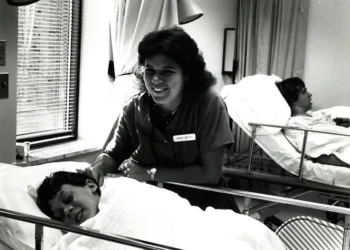 Mary Beth Straub, RN with child laughing-crop